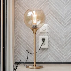 Gouden tafellamp met amber glazen bol 20 cm