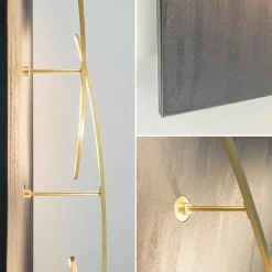 Grote design wandlamp met gouden kapjes