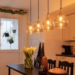 4-Lichts eettafelhanglamp zwart/goud met amber glazen bollen