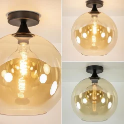 Mat zwarte plafondlamp met amber glazen bol 30 cm